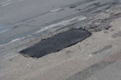 Pothole asphalt patching, asphalt road crack pothole repair, driveway, pavement patching repair.